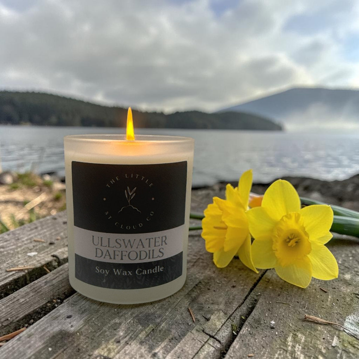 Lit frosted candle jar in the scent ullswater daffodils by the little st cloud co with lakeside views and daffodils